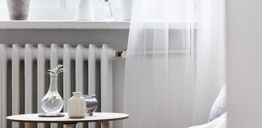 Home interior with small table Stylish home interior with small table standing beside window