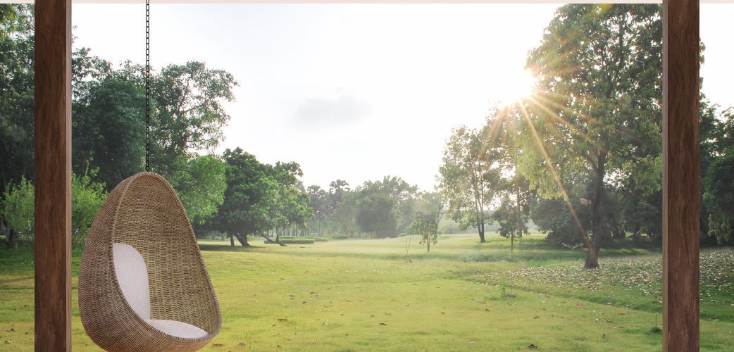 Wooden terrace with morning garden view 3d render, There are wooden floor,Decorate with rattan egg shaped chair,looking out over the large lawn.